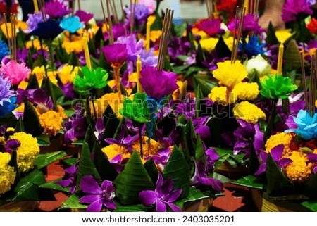 Colorful handmade krathong or floating lantern basket sale thai people into float ritual vessel at river for forgiveness from Khongkha Goddess of water in Loy Krathong festival in Nonthaburi, Thailand