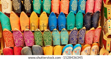 Colorful handmade leather slippers (babouches) on a market in Marrakech, Morocco