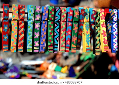 Colorful Hand-painted Clothes Pins Displayed At A Craft Show.