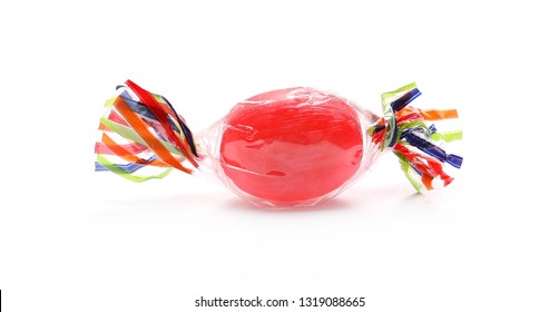 Colorful Hard Candy In Transparent Cellophane Wrapping, Isolated On White Background