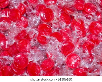 Colorful Hard Candy In Wrappers As A Background