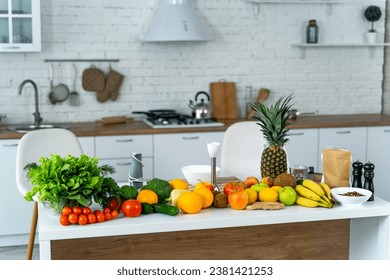 A Colorful Harvest: Fresh Fruits and Vegetables on a Kitchen Counter. A kitchen counter with a variety of fruits and vegetables on it - Powered by Shutterstock