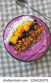 Colorful, Healthy Food. Acai Smoothie Bowl. Keto Breakfast Idea. Fruit Curd Smoothie, Granola, Fruit.