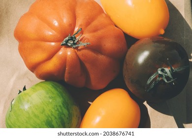 Colorful Heirloom Tomatoes On The Rustic Paper Bag Background