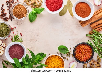 Colorful Herbs And Spices For Cooking: Turmeric, Dill, Paprika, Cinnamon, Saffron, Basil And Rosemary. Indian Spices. On Light Brown Stone Background. Top View.