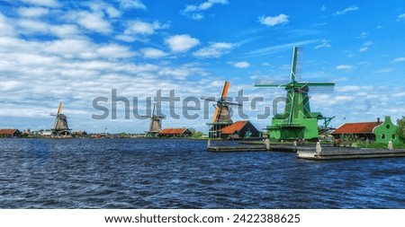 Colorful historic windmills at the Zaan river in Zaanse Schans, Netherlands