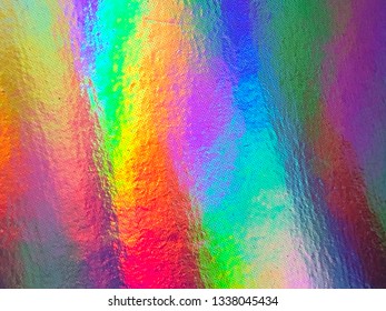 Colorful holographic background. Modern foil, futuristic blurred template. Neon pastel, hologram and rainbow colors. Abstract gradient. Bright and shiny hipster style for covers. Glass reflections