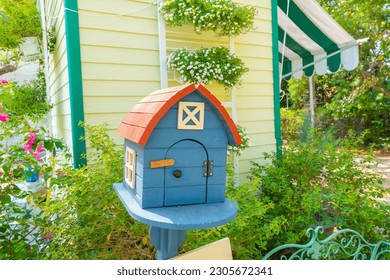 Colorful home mailbox in garden.