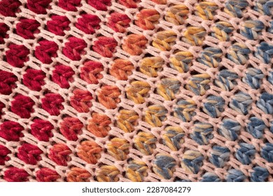 Colorful homemade knitwear texture as a background.