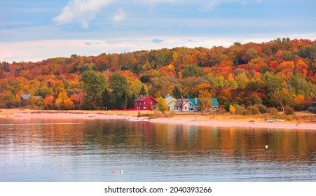 Colorful Homes At The Lake Superior Shore Surrounded By Fall Foliage In Michigan