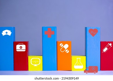 A Colorful Hospital Building Center Concept, Healthcare And Medicine Service With Ambulance Tall And Short Box Building, Medical Sign With Wood Colorful Box.