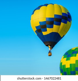 Colorful Hot Air Balloon Taking Off With Blue Sky And Copy Space