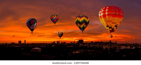 Colorful Hot Air Balloons  Flying Above City Scape At Sunset Time With  Beautiful Twilight Sky Background