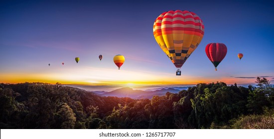 Colorful hot air balloons flying over mountain at Dot Inthanon in Chiang Mai, Thailand - Shutterstock ID 1265717707
