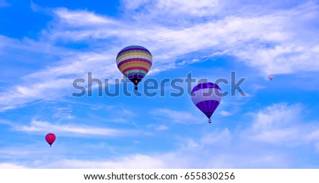 Colorful hot air baloons flying in a summer afternoon