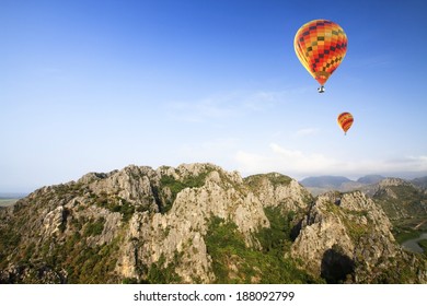 Colorful hot-air balloons flying over the mountain 