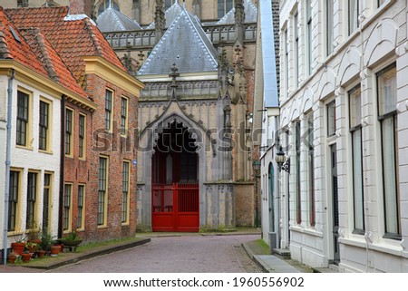 Colorful house facades on Kerkstraat street in Zaltbommel, North Brabant, Netherlands, a fortified city located 15km far from Hertogenbosch, with Sint Maartenskerk church in the background Stock photo © 