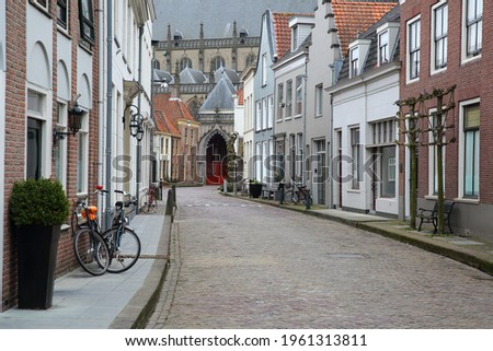 Colorful house facades on Kerkstraat street in Zaltbommel, North Brabant, Netherlands, a fortified city located 15km far from Hertogenbosch, with Sint Maartenskerk church in the background Stock photo © 
