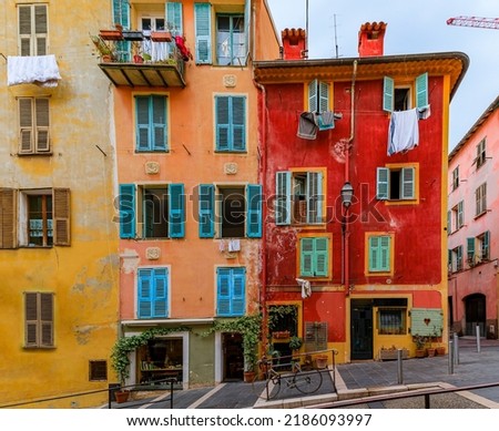 Colorful house facades on a street in Old Town, Vieille Ville in Nice, French Riviera, South of France