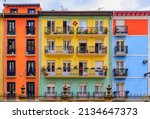 Colorful house facades and ornate metal balconies with flowers in the old town or Casco Viejo in Pamplona, Spain famous for running of the bulls