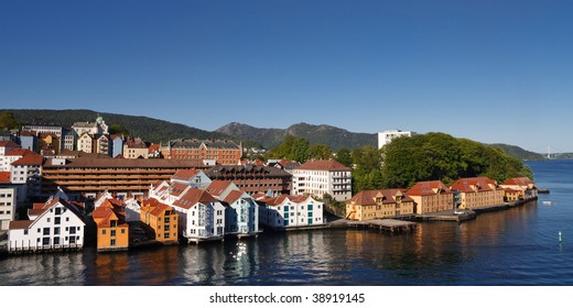 Colorful Houses In The City Of Bergen, Norway, At The Fjord Shoreline. Clear Blue Sky On A Summer Day.