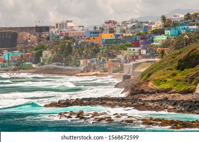 Colorful Houses line the hillside over looking the beach in San Juan, Puerto Rico.