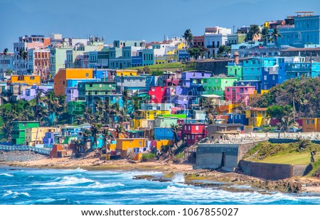 Colorful houses line the hillside over looking the beach in San Juan, Puerto Rico