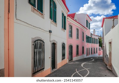 Colorful houses on pedestrian cobblestone street in Cascais, Portugal. - Powered by Shutterstock