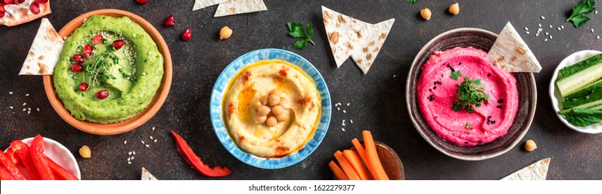 Colorful Hummus Bowls, Healthy Vegan Dips. Traditional Middle Eastern,  Green And Beetroot Hummus, Spread. 