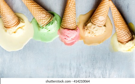 Colorful Ice Cream Cones Of Different Flavors. Melting Scoops. Top View, Copy Space, Steel Metal Background