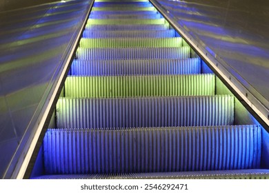 Colorful Illuminated Escalator Steps in Underground Station - Powered by Shutterstock