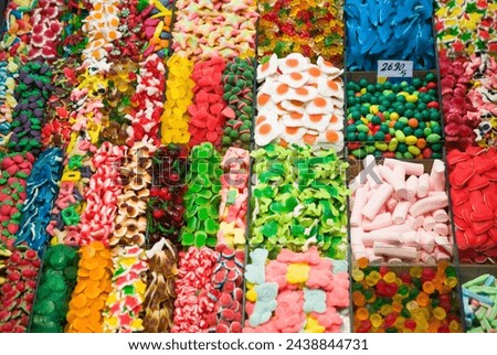 Colorful image jellies of various sweets, candied fruit jelly at market stall