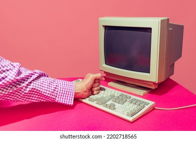 Colorful Image Of Vintage Computer Monitor And Keyboard Isolated Over Bright Pink Background. Concept Of Retro Pop Art, Vintage Things, Mix Old And Modernity. Copy Space For Ad