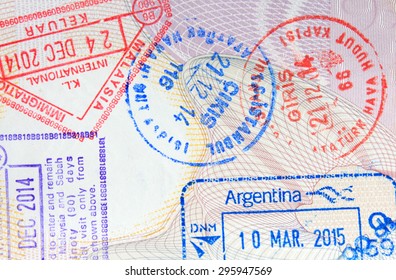 Colorful immigration arrival stamps on passport