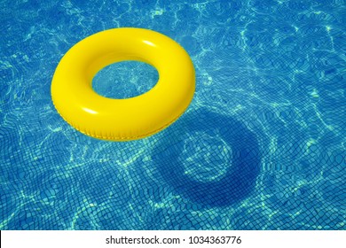 Colorful inflatable tube floating in swimming pool, summer vacation concept