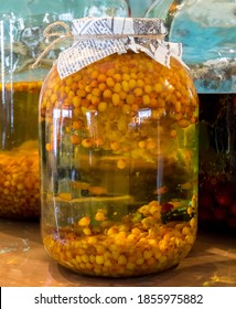 Colorful jar of homemade preservative from sea buckthorn