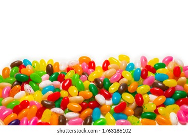 Colorful jelly beans isolated on white. Top view.  - Powered by Shutterstock