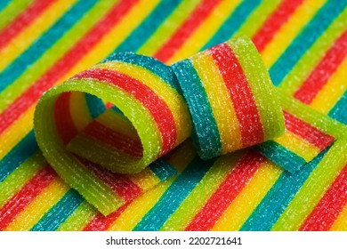 Colorful Jelly Candies Strips In Sugar Sprinkles. Sour Flavored Rainbow Candy Background