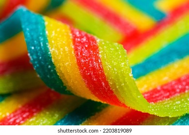 Colorful Jelly Candies Strips In Sugar Sprinkles. Sour Flavored Rainbow Candy Background