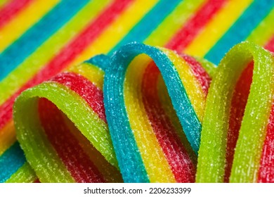 Colorful Jelly Candies Strips In Sugar Sprinkles. Sour Flavored Rainbow Candy Background