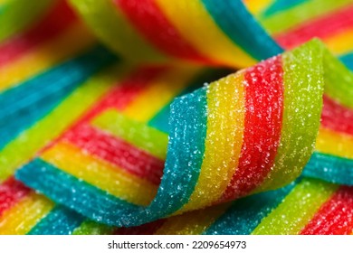 Colorful Jelly Candies Strips In Sugar Sprinkles. Sour Flavored Rainbow Candy Background