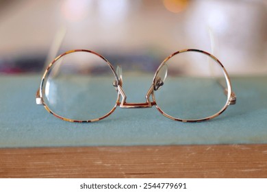 Colorful jigsaw puzzle pieces, books, tablet, glasses, cookies, berries, cup of tea or coffee, glass of juice and lit candles on the table. Hygge in pastel colors. Selective focus. - Powered by Shutterstock