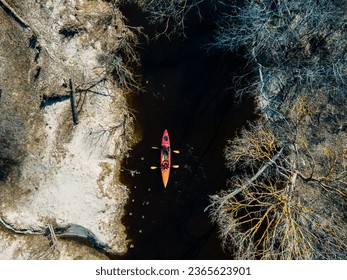 Colorful kayaks float on the river