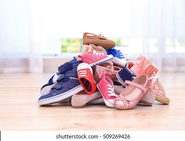 Colorful Kids Shoes On Floor