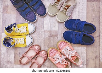 Colorful Kids Shoes On Floor
