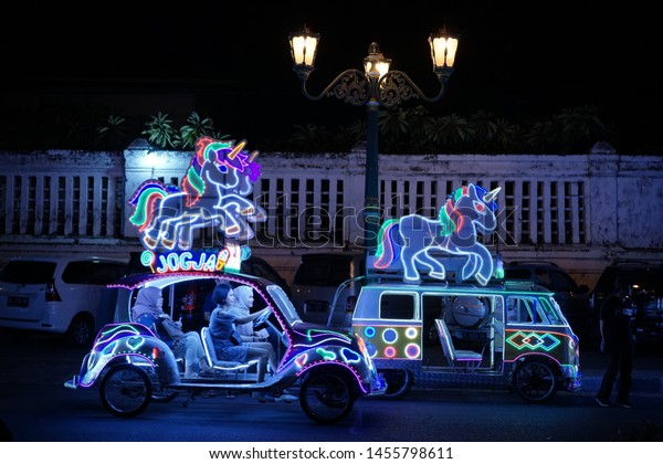 Colorful of Car’s Lamp in the night, Some\
people who drive the traditional car with a pedal when spend them\
holiday in Yogyakarta City, 14 July\
2019