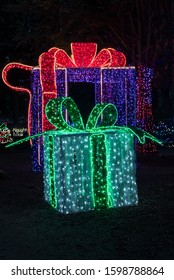 Colorful Large Green And Purple Gift Boxes And Red Ribbon Outdoor Park Christmas Holiday Light Display.
 