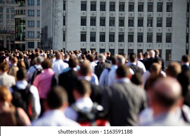 Colorful Large Group Of Commuters Walking To Work. No One Is Identifiable. London, Summer. Space For Captions Or Graphics