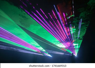 Colorful laser and stage lights isolated on black, laser show.