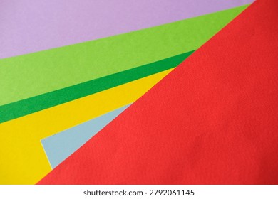 Colorful layered fields and angular shapes form a vibrant modern abstract motif for bold design purposes.